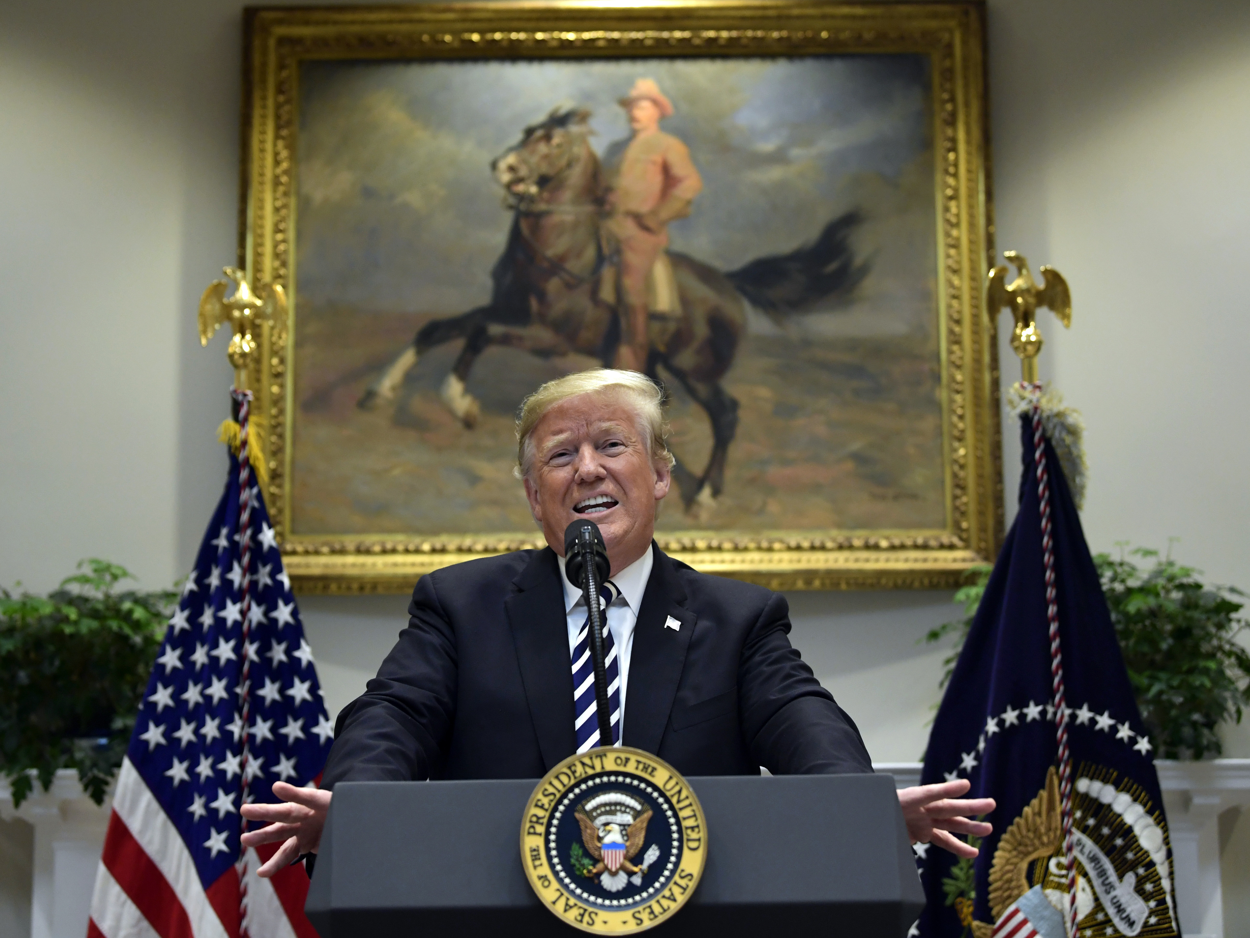 caption: President Trump talks about immigration and gives an update on border security from the Roosevelt Room of the White House on Thursday.