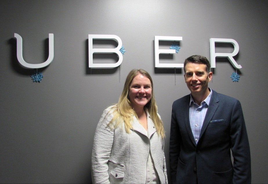 caption: Uber General Manager Brooke Steger and chief adviser David Plouffe at the company's Seattle offices.