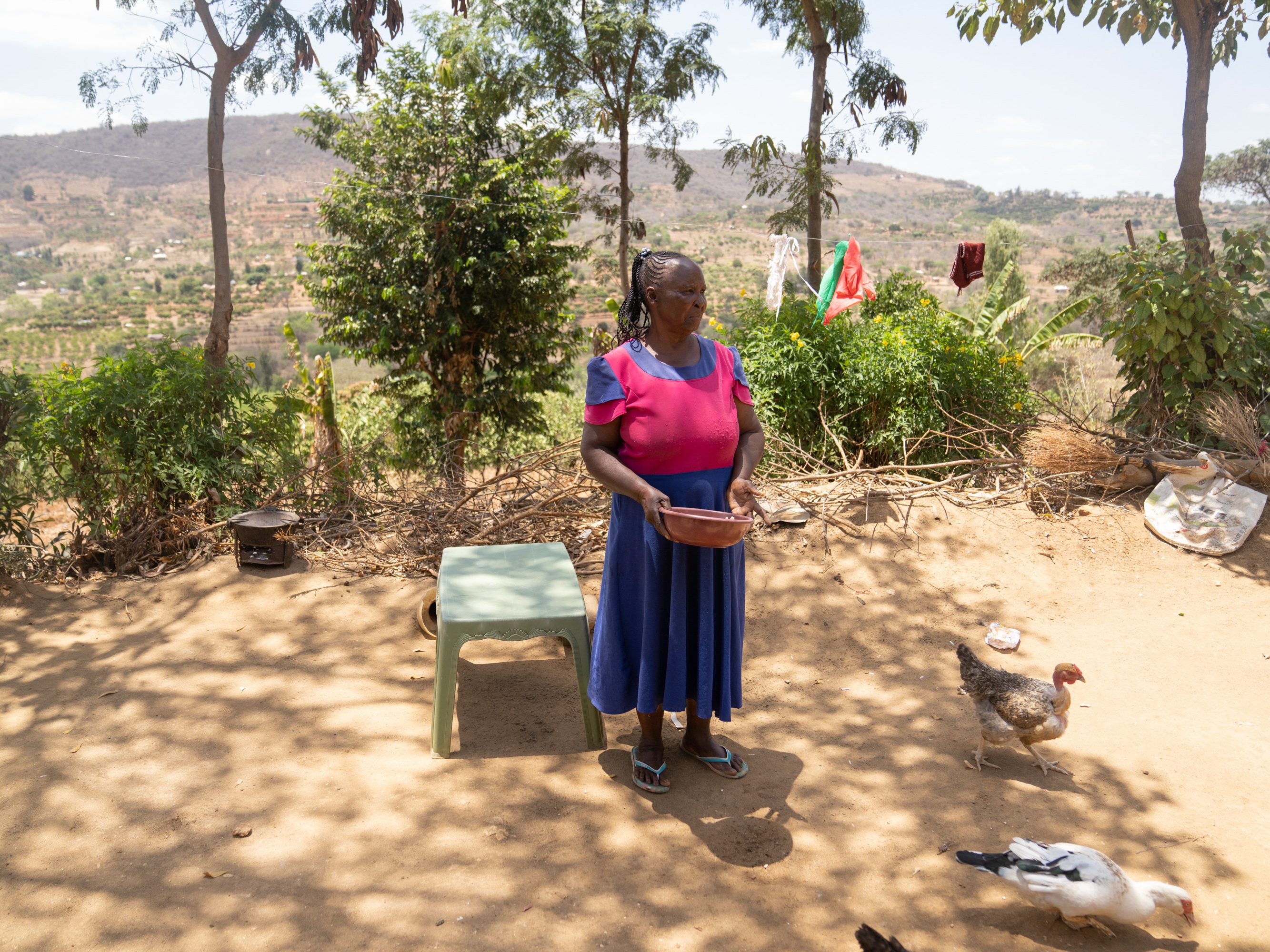 caption: Joyce Mutisya, photographed in 2023 outside her home in Wote, Kenya. For years she struggled with symptoms of dementia. But she didn't realize it was a condition for which she could seek professional help.