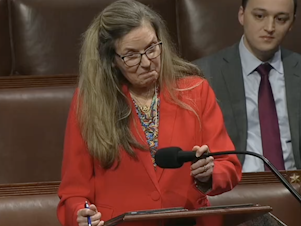 caption: Virginia Rep. Jennifer Wexton used text-to-speech technology to advocate for her bill on the House floor Monday, following her diagnosis with the rare brain condition known as progressive supranuclear palsy.