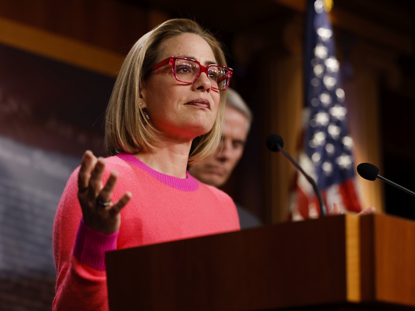 caption: Sen. Kyrsten Sinema of Arizona speaks at the U.S. Capitol after the Senate passed the Respect for Marriage Act in November. Sinema announced Friday she would register as an independent rather than a Democrat.