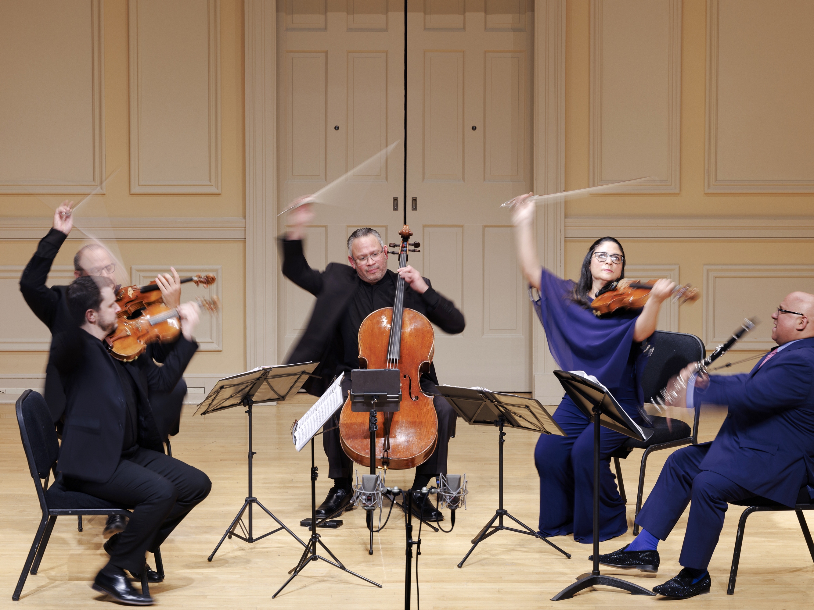 caption: The Dalí Quartet, accompanied by Ricardo Morales on clarinet, performs during the Library of Congress' Stradivari concert in Coolidge Auditorium in 2023. The Library was given a rare set of Stradivarius instruments in 1935.