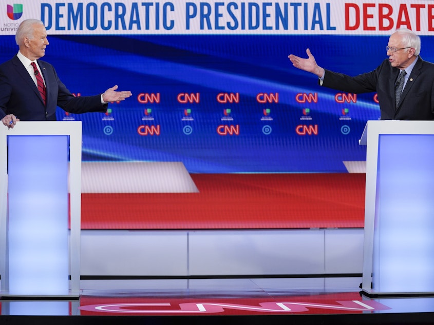 caption: Former Vice President Joe Biden, left, and Sen. Bernie Sanders participated in their final Democratic presidential primary debate last month in Washington, D.C.