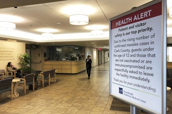 caption: <p>In this Jan. 25, 2019, file photo, a sign prohibiting all children under 12 and unvaccinated adults stands at the entrance to PeaceHealth Southwest Medical Center in Vancouver, Washington.</p>