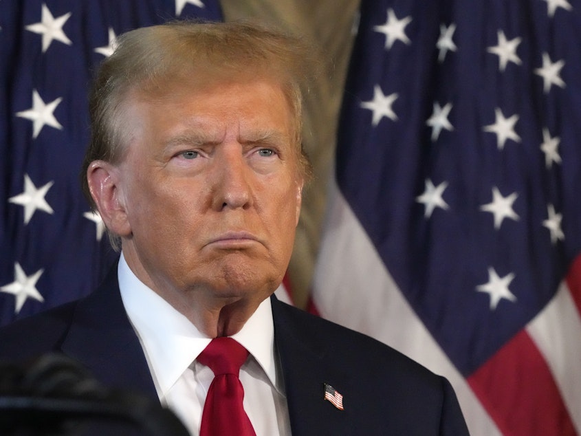 caption: Republican presidential candidate former President Donald Trump attends a news conference with Speaker of the House Mike Johnson, R-La., on April 12, at Mar-a-Lago in Palm Beach, Fla.