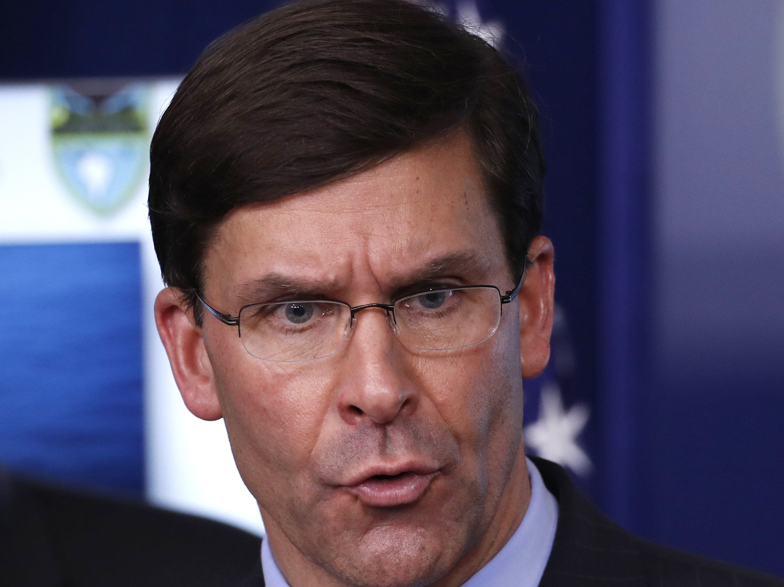 caption: Defense Secretary Mark Esper speaks about the coronavirus in the James Brady Press Briefing Room of the White House on Wednesday.