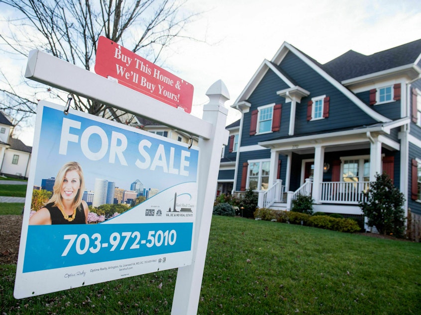 caption: Household finances improved between 2019 and 2022, according to a new survey from the Federal Reserve. Home ownership increased, despite a drop in affordability.