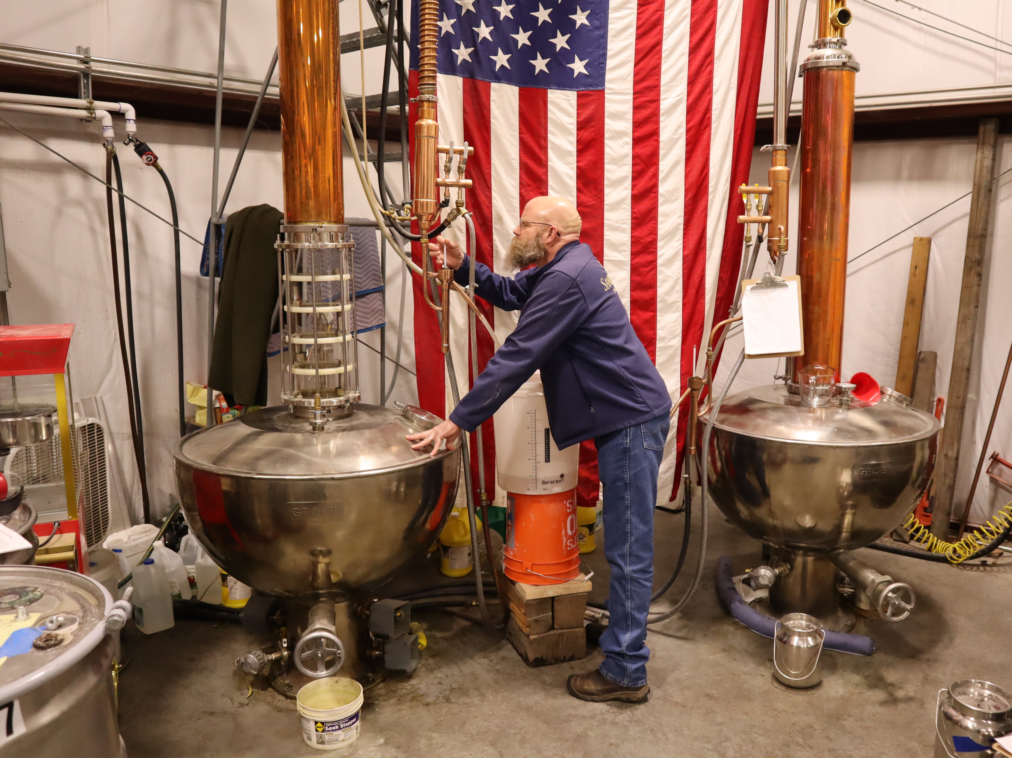 caption: Sandstone Distillery owner John Bourdon wants his liquor to display the terroir of the grains it was made from.