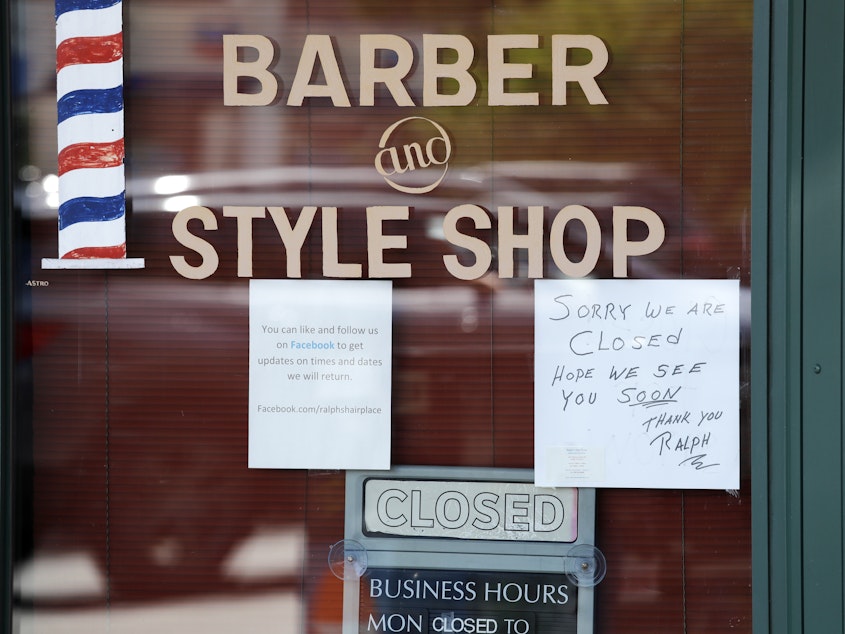 caption: A Seattle barbershop is closed (May 19, 2020) because of the coronavirus outbreak in the state.