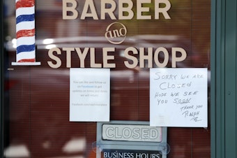 caption: A Seattle barbershop is closed (May 19, 2020) because of the coronavirus outbreak in the state.