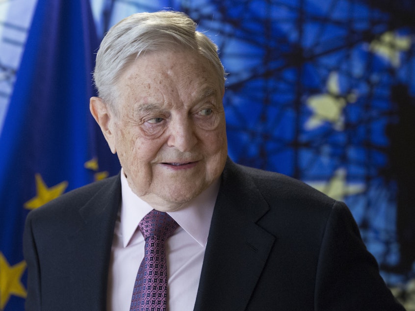 caption: George Soros waits for the start of a meeting at EU headquarters in Brussels in 2017. A mailed explosive device was discovered at his home on Monday afternoon.