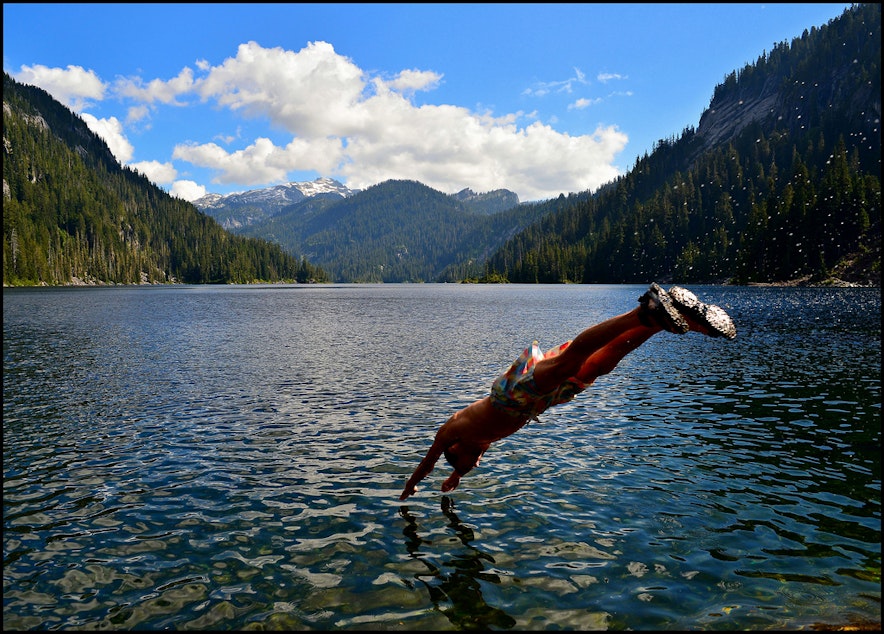 caption: A swimmer dives into Lake Dorothy in eastern King County on a hot July day in 2013.