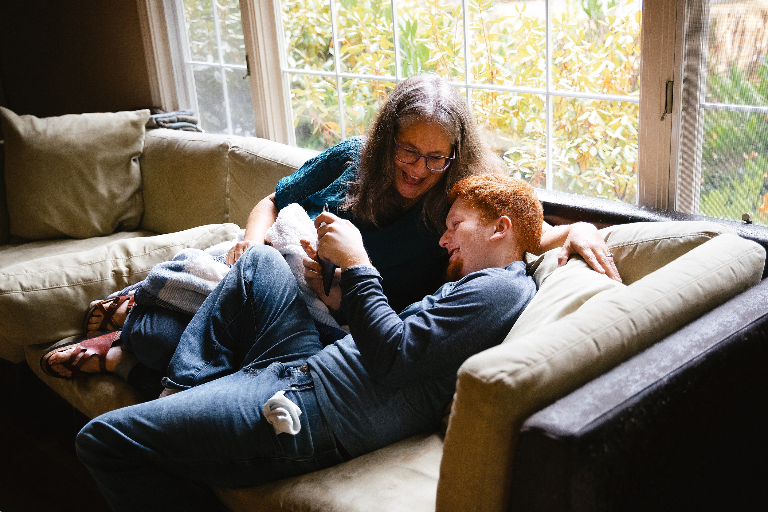 caption: Rachel Nemhauser, left, laughs with her son, Nate Nemhauser, 21, at their home on Friday, August 15, 2025, in Bellevue. 