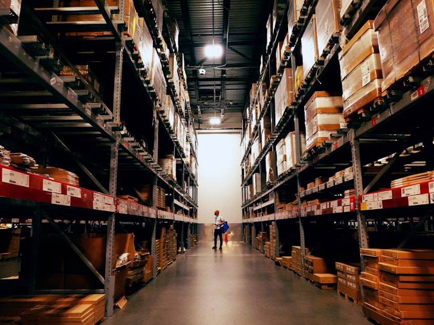 caption: A person walks in an Ikea warehouse in New York City on Oct. 15.