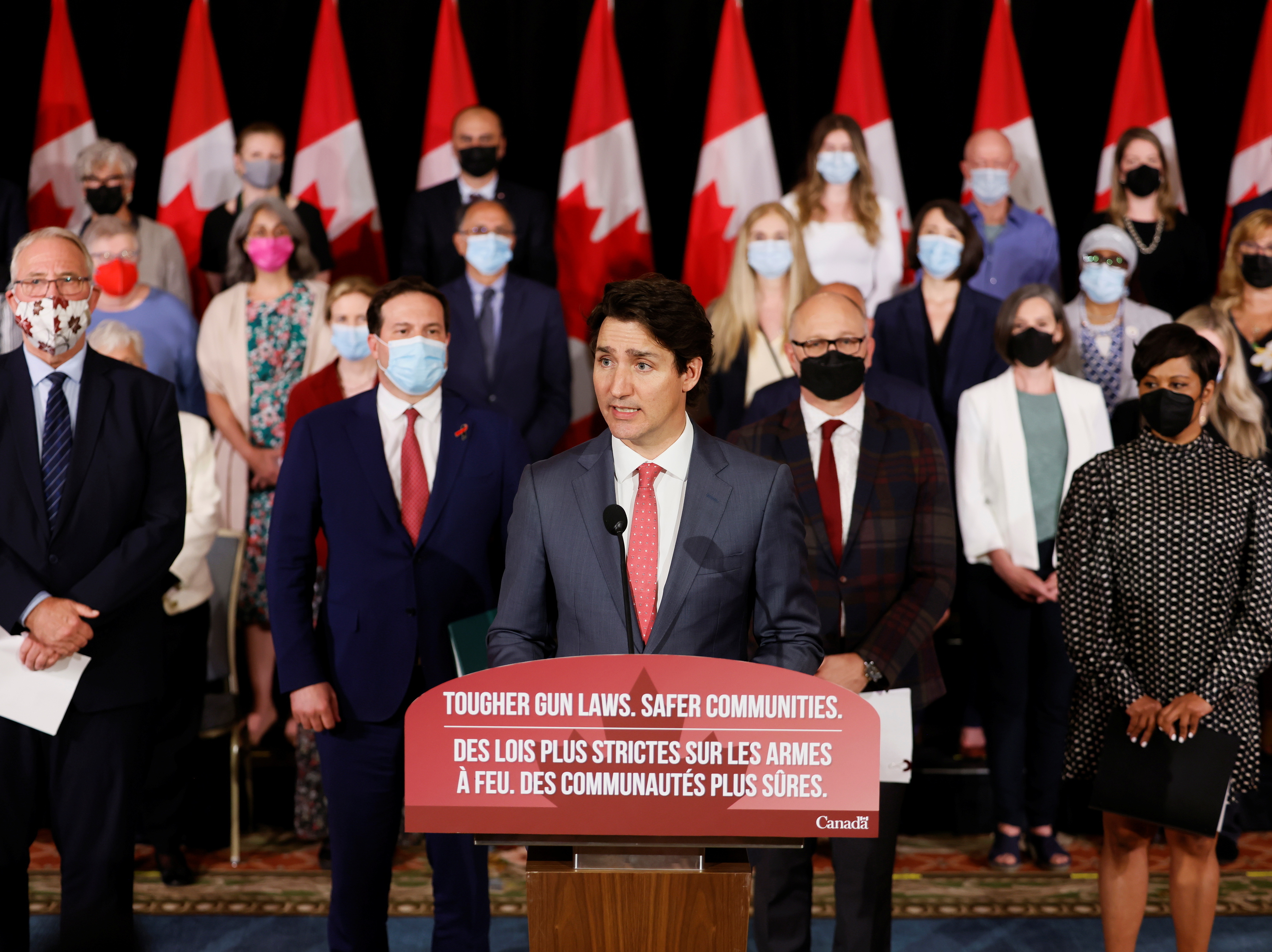 caption: Canada's Prime Minister Justin Trudeau, with government officials and gun control advocates, speaks at a news conference on May 30 about firearm-control legislation that was tabled in the House of Commons in Ottawa, Ontario, Canada.