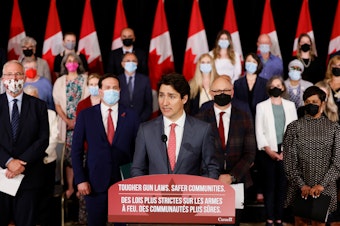 caption: Canada's Prime Minister Justin Trudeau, with government officials and gun control advocates, speaks at a news conference on May 30 about firearm-control legislation that was tabled in the House of Commons in Ottawa, Ontario, Canada.