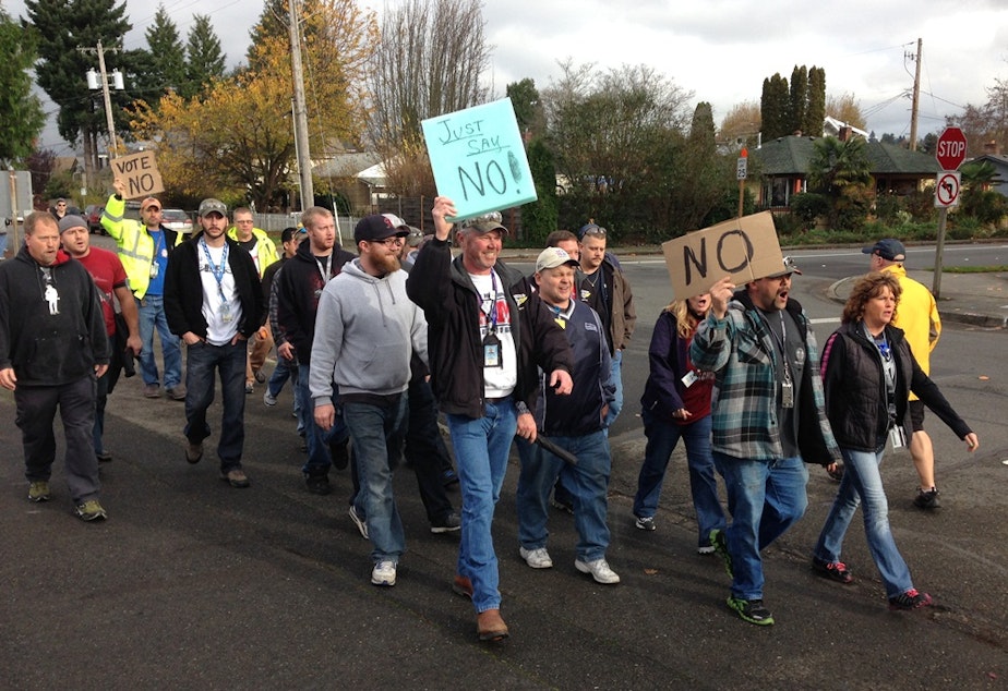 caption: Boeing union workers oppose the proposed contract for machinists.