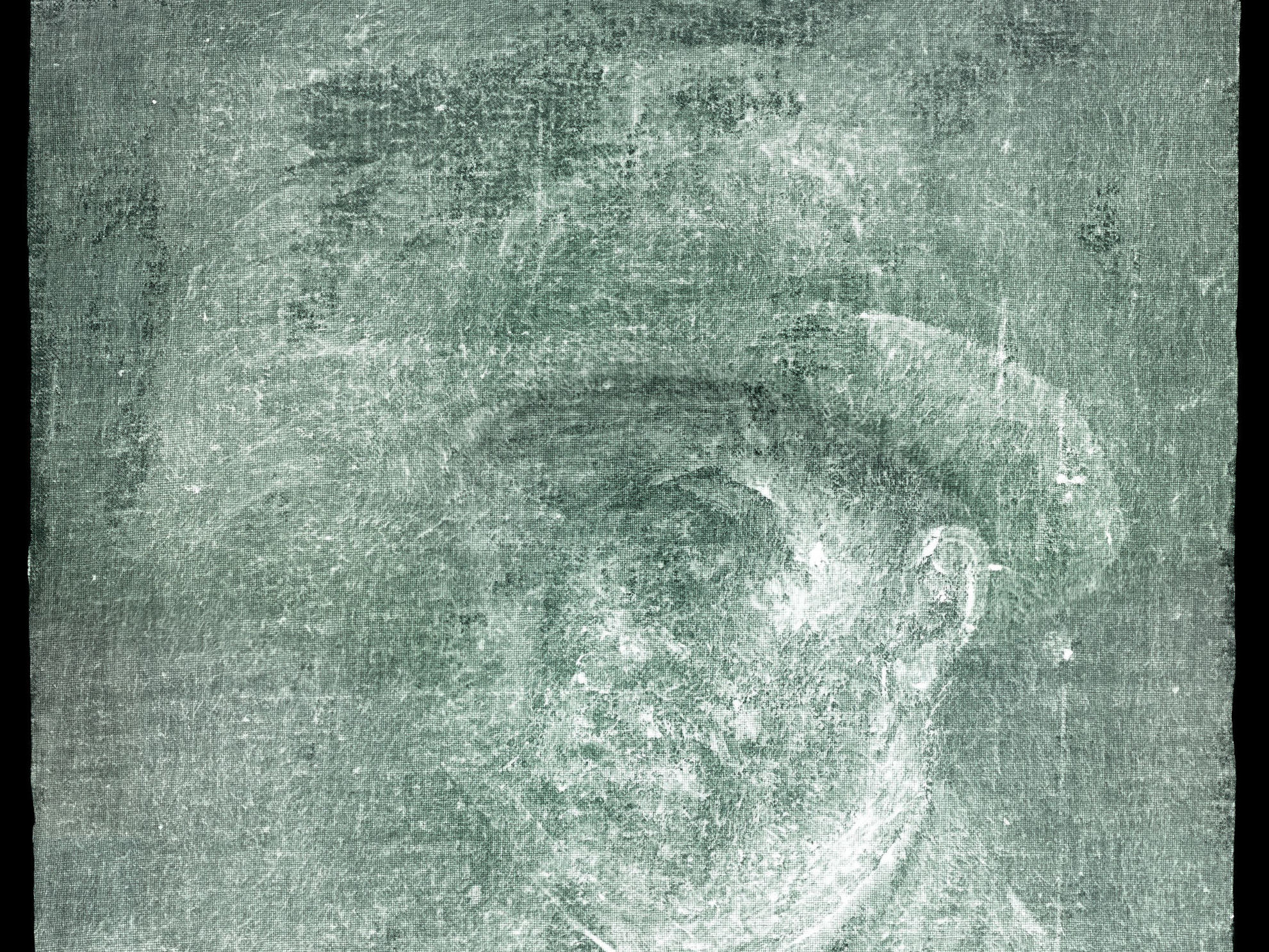 caption: An X-ray image shows this previously unknown self-portrait of Vincent Van Gogh painted on the reverse side of his painting <em>Head of a Peasant Woman.</em>