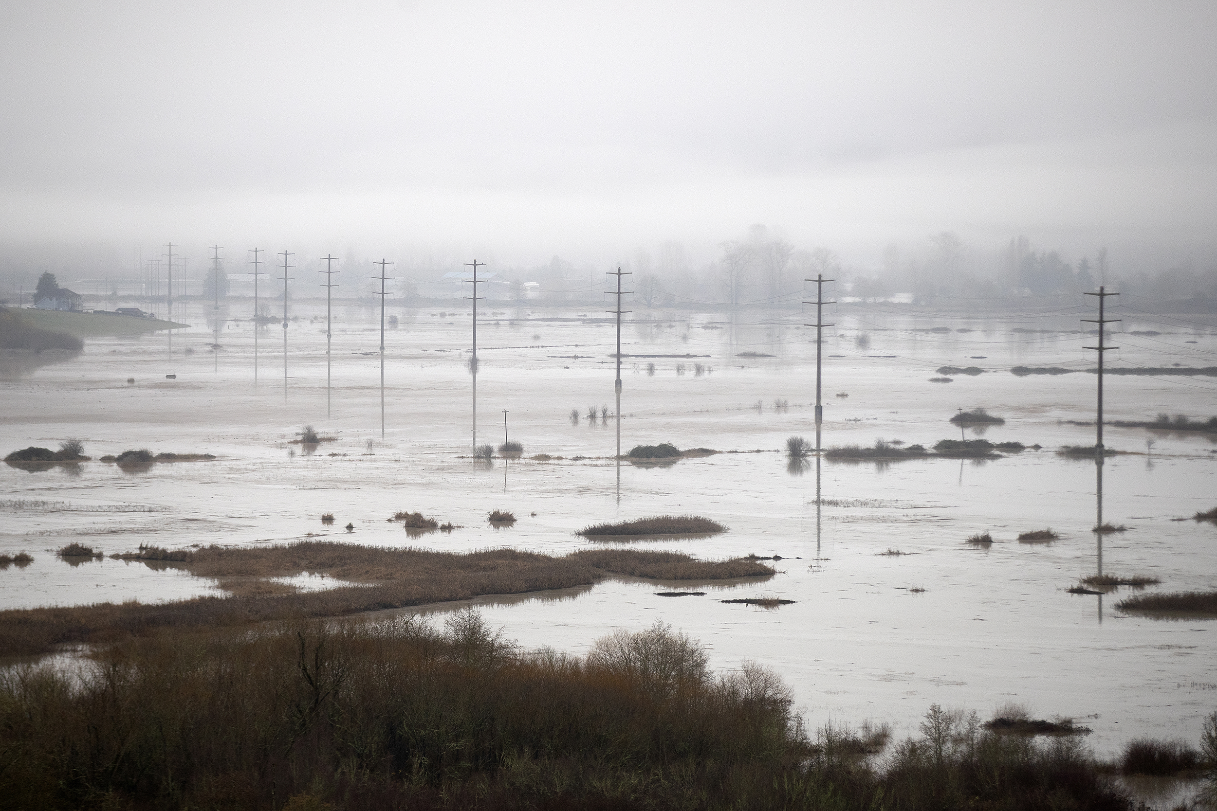 caption: Floodwaters are shown on Friday, December 12, 2025, in Snohomish.  