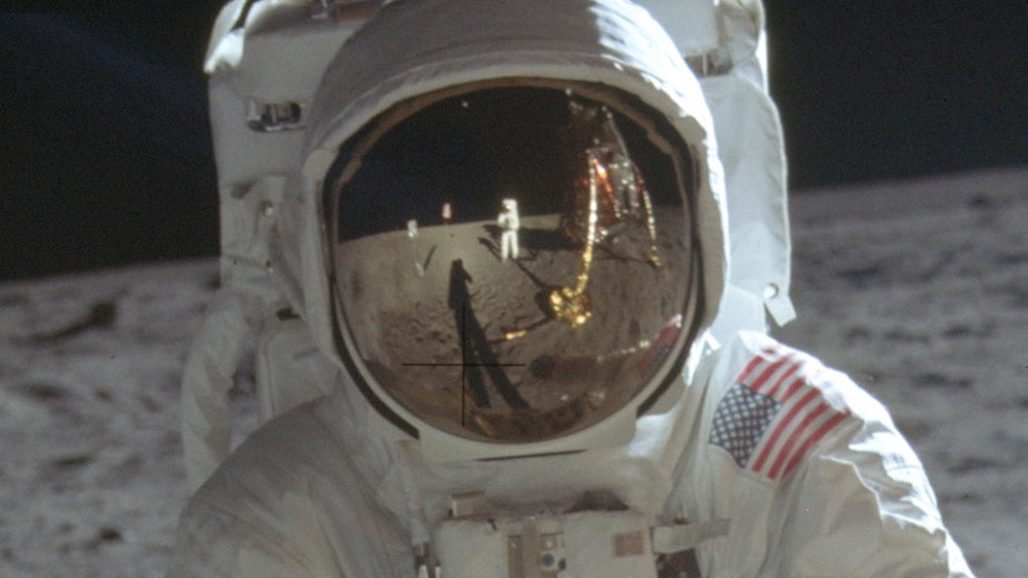 caption: This detail of a July 20, 1969, photo made available by NASA shows astronaut Neil Armstrong reflected in the helmet visor of Buzz Aldrin on the surface of the moon.
