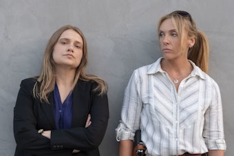 caption: Merritt Wever and Toni Collette play two detectives investigating a series of sexual assaults in the Netflix show <em>Unbelievable</em>.