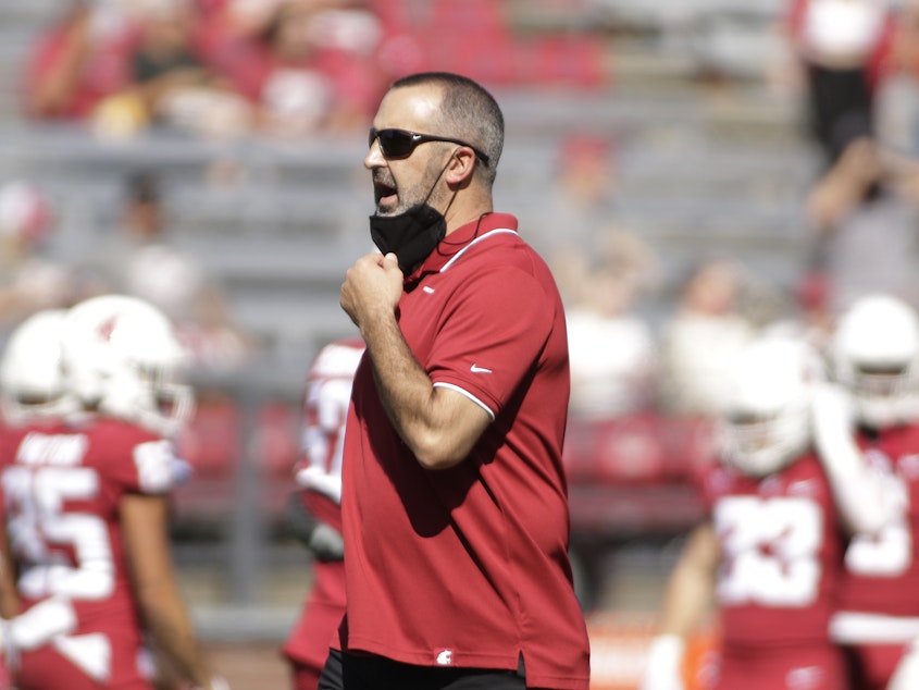caption: Washington State University head coach Nick Rolovich speaks to his players before an NCAA college football game against Portland State on Sept. 11, 2021, in Pullman, Wash.