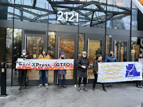 caption: Amazon has canceled plans to use natural gas from a proposed pipeline expansion in Oregon, something activists called for during a protest at company headquarters in March 2024. 