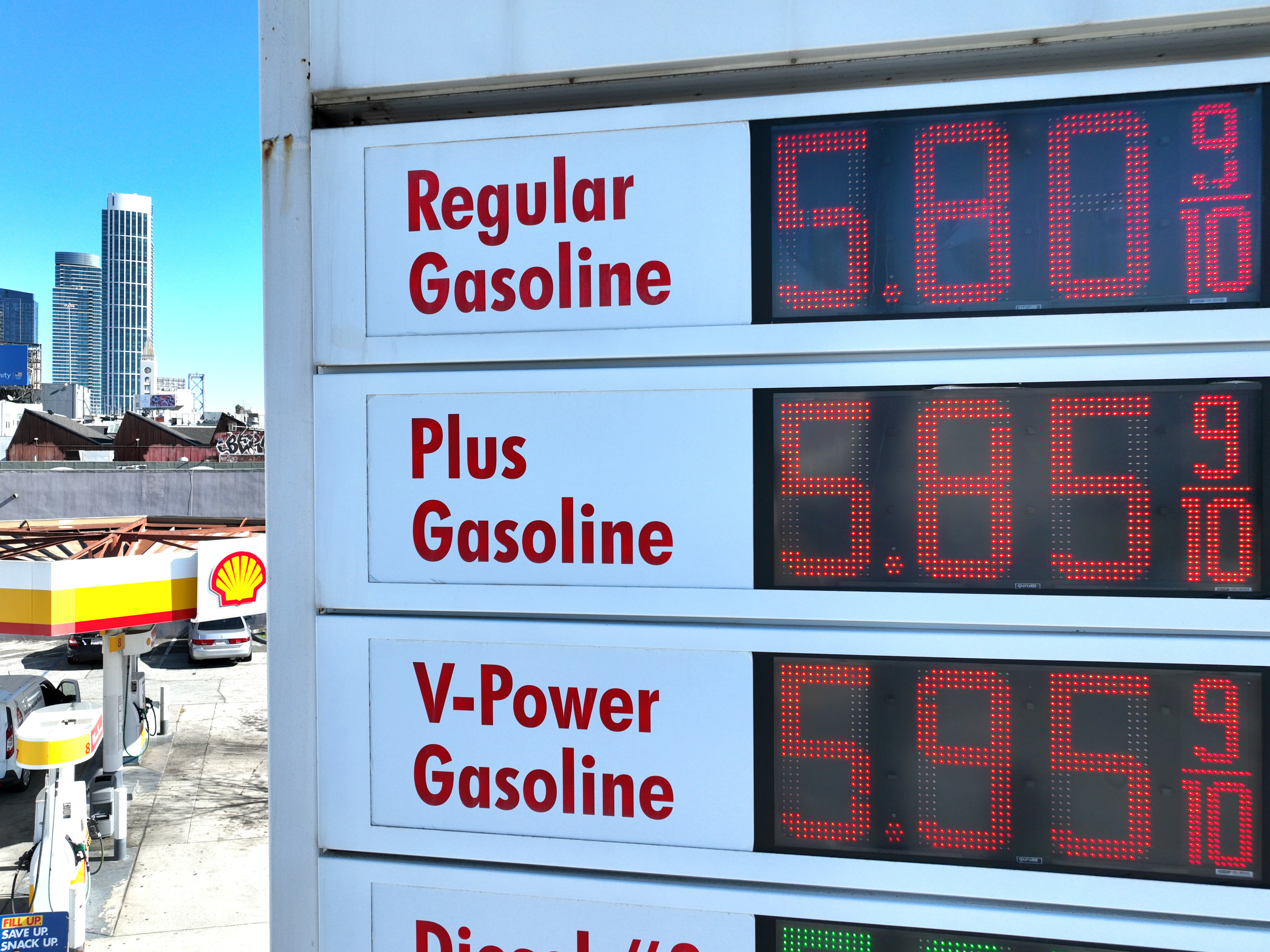 caption: A sign shows gas prices at a Shell station in San Francisco on Feb. 23. Gas prices could rise further as crude prices surge following Russia's invasion of Ukraine.
