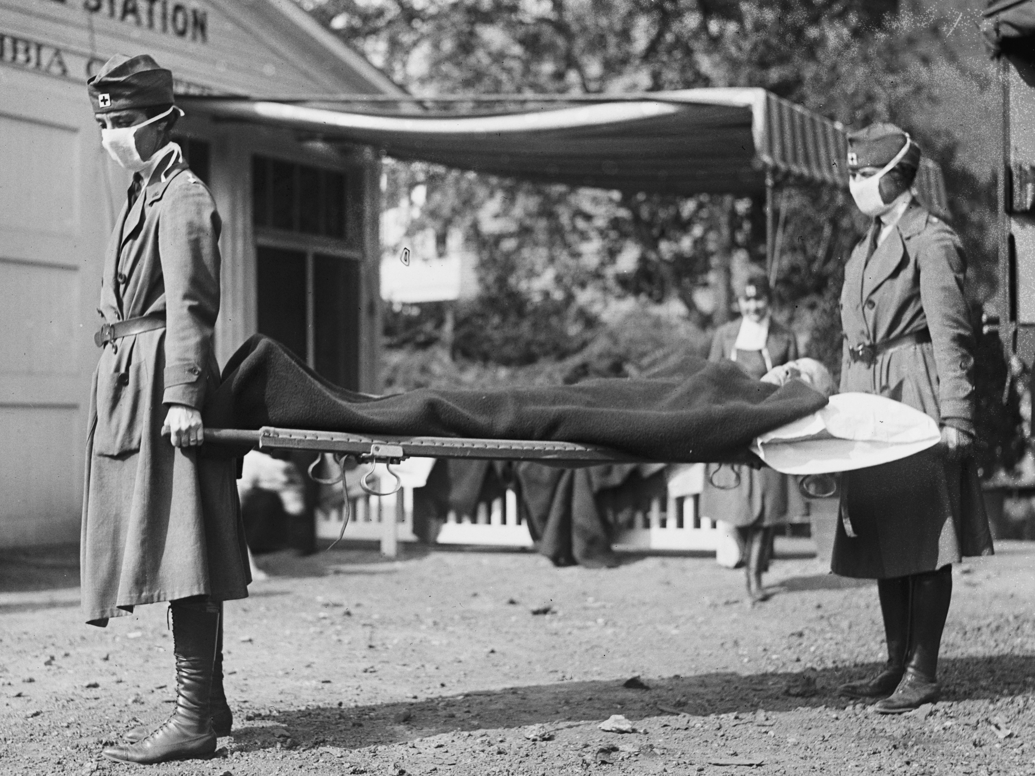 caption: This photo made available by the Library of Congress shows a demonstration at the Red Cross Emergency Ambulance Station in Washington during the influenza pandemic of 1918.