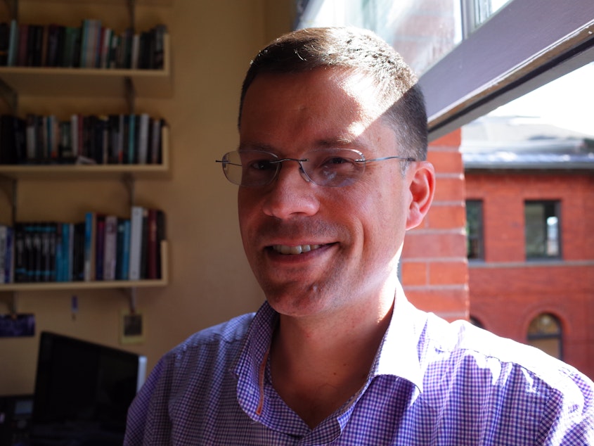 caption: Jacob Vigdor at the University of Washington's Evans School of Public Policy. He says Seattle's worker protections measures can't protect workers from the impact of technology. Whole lines of work are dying out, and workers face displacement.