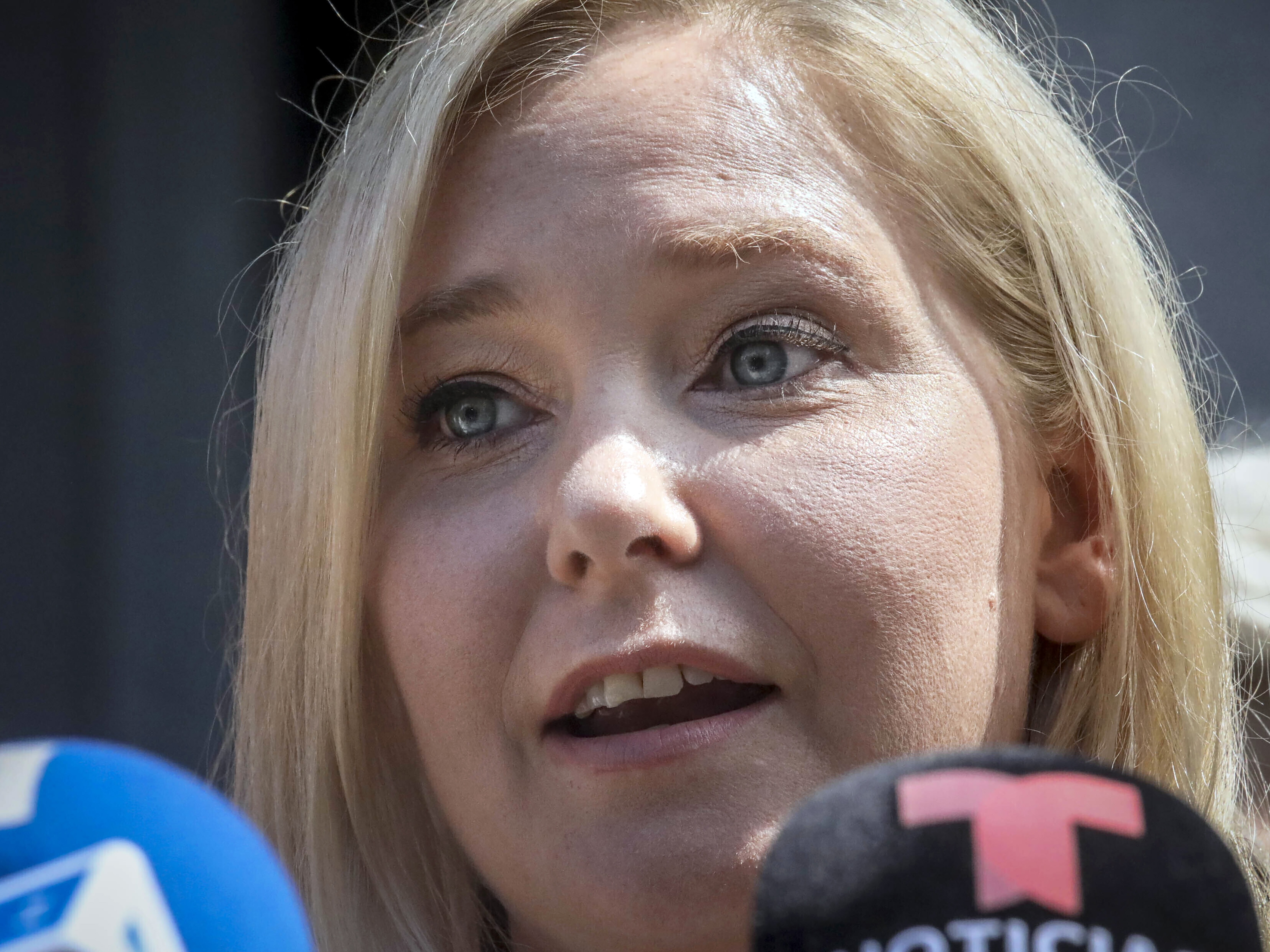 caption: Virginia Giuffre speaks during a news conference outside a Manhattan court in New York, Aug. 27, 2019.
