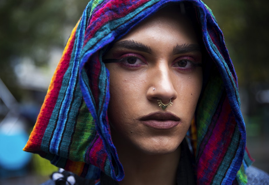 Kenta Puv, 19, poses for a portrait during the Indigenous People's Day march and celebration on Monday, October 8, 2018, at Westlake Park in Seattle.