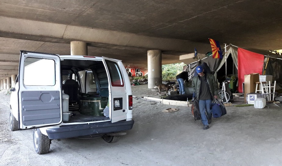 caption: Darrel Sutton, after camping in Seattle's Jungle homeless camp for more than a year, moves with help from Union Gospel Mission workers.