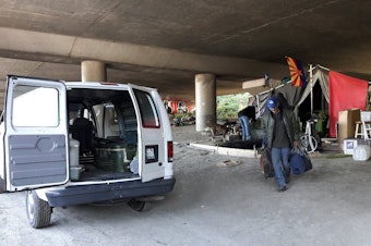 caption: Darrel Sutton, after camping in Seattle's Jungle homeless camp for more than a year, moves with help from Union Gospel Mission workers.