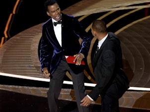 caption: Chris Rock and Will Smith are seen onstage during the 94th Annual Academy Awards at Dolby Theatre following what appeared to be an altercation.