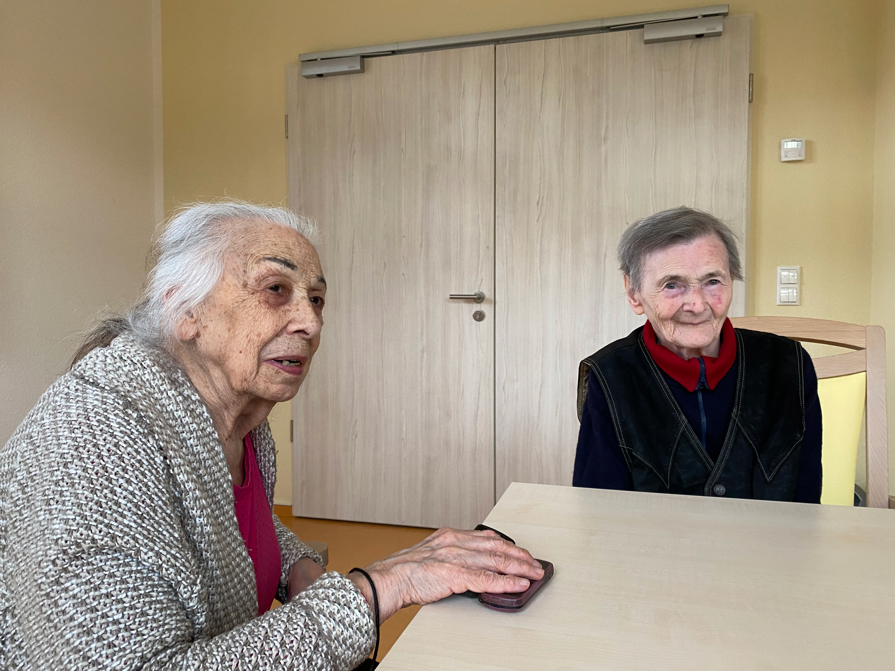 caption: Alla Ilyinichna Sinelnikova (left), 90, and Sonya Leibovna Tartakovskaya, 83, were recently evacuated from Ukraine to Germany. Both are survivors of the Holocaust, and this is the second time they are fleeing war. "I never thought I would live to see such horror for the second time in my life," says Sinelnikova. "I thought it was in my past, all over and done with. And now we're reliving it."
