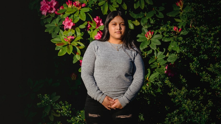 caption: Michelle Aguilar Ramirez stands for a portrait on in South Seattle, Washington, May 18, 2020.