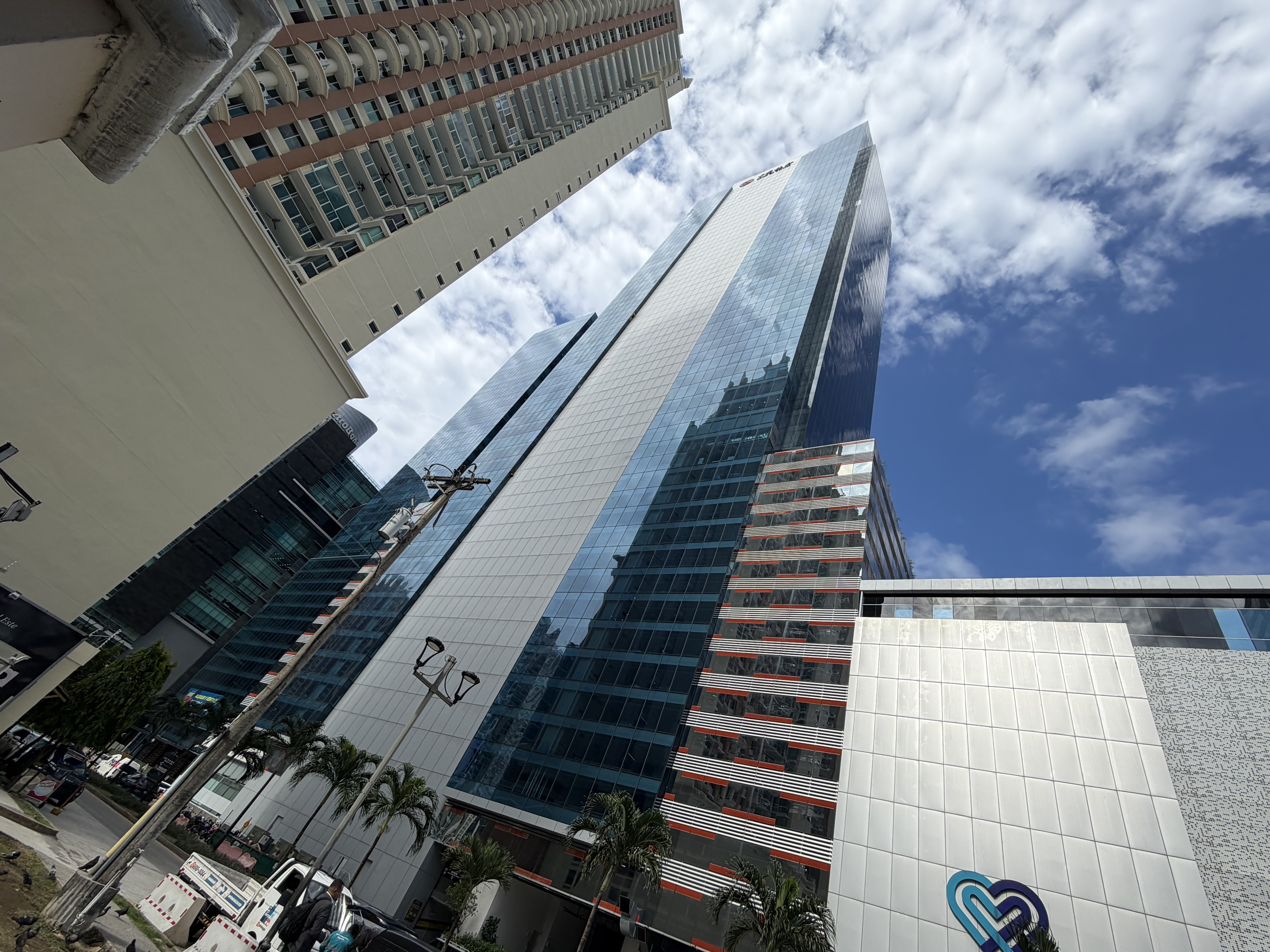 caption: Polymarket claims its headquarters is on the 21st floor of the Oceania Business Plaza. So do more than a dozen other crypto companies. But the address leads to a law firm.