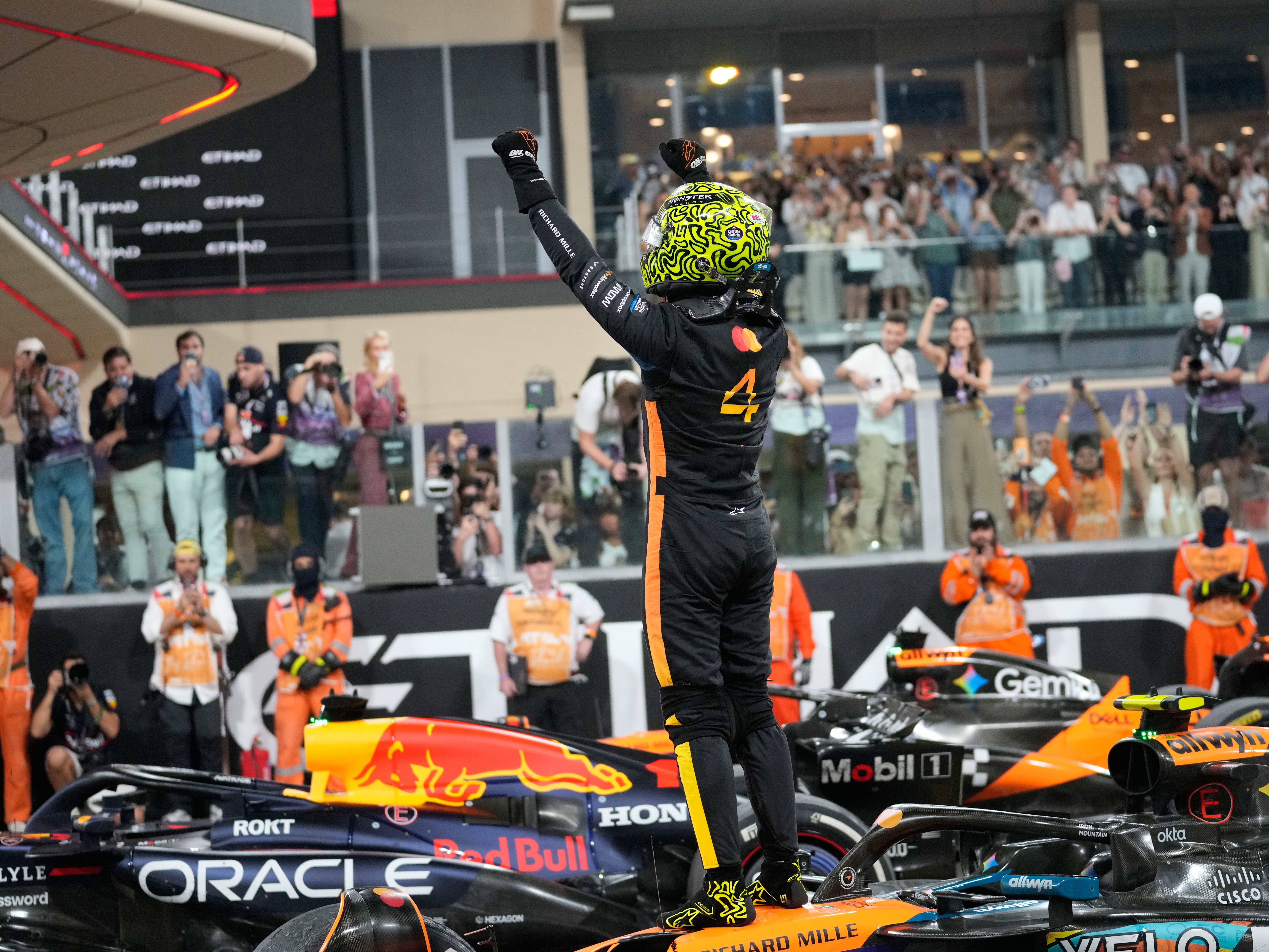 caption: McLaren driver Lando Norris of Britain reacts after becoming a world champion after the Abu Dhabi Formula One Grand Prix in Abu Dhabi, United Arab Emirates, Sunday, Dec. 7, 2025.