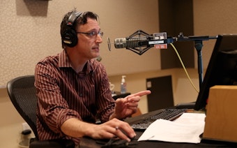 caption: Bill Radke, host of the Record, reads an apology on air on Friday, Sept. 22. 