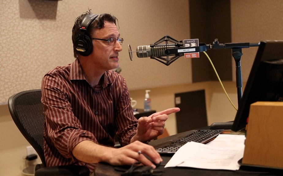 caption: Bill Radke, host of the Record, reads an apology on air on Friday, Sept. 22. 