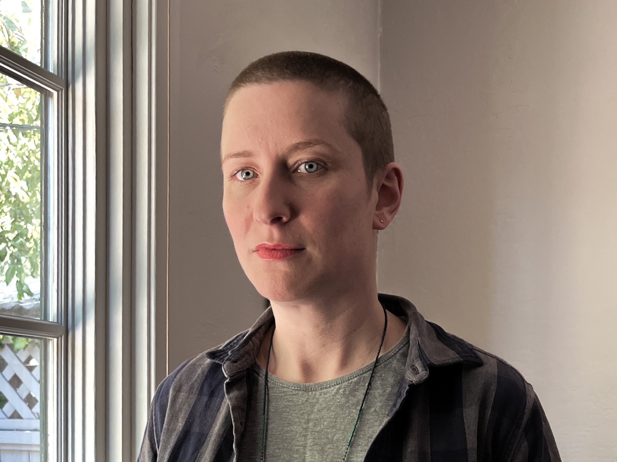 caption: Caitlin Tulloch at home.