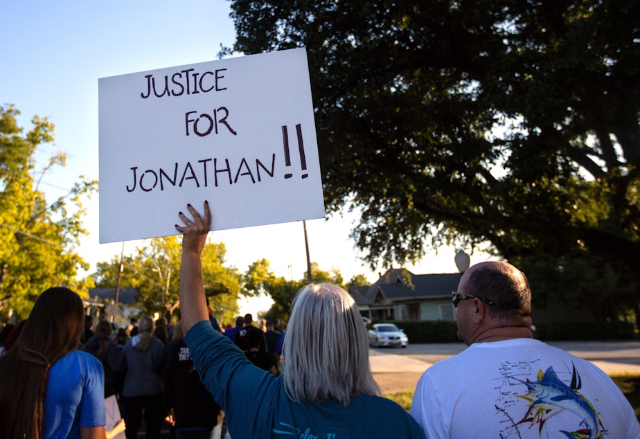 caption: People gather for a march, rally and candlelight vigil in honor Jonathan Price in Wolfe City, Texas, on Monday. Wolfe City police officer Shaun Lucas has been charged in relation to the fatal shooting.