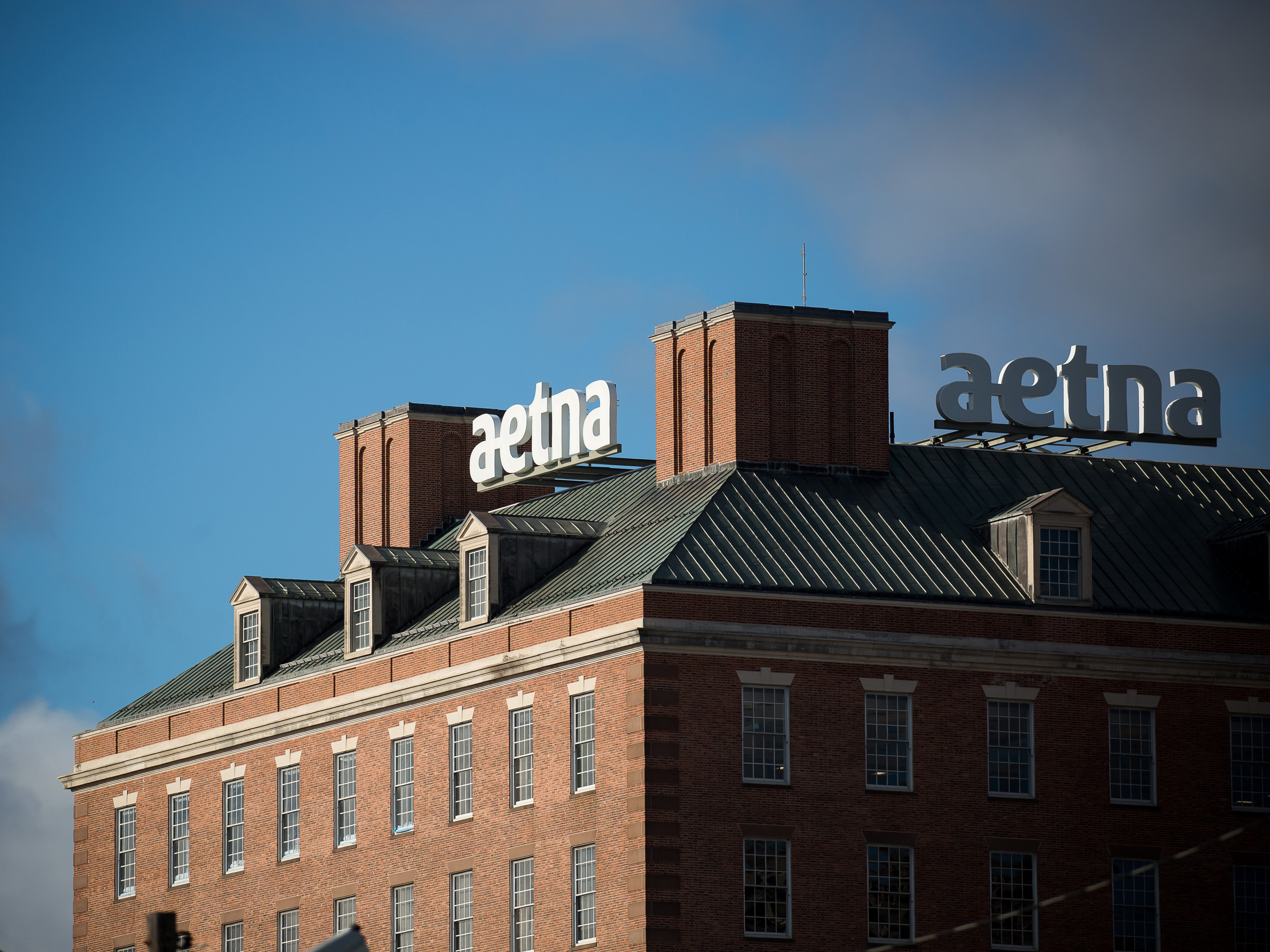 caption: Aetna was the first insurer to announce its plan to help shield patients with COVID-19 from high medical bills. But out-of-network charges and other surprise bills remain a risk, say advocates for patients.