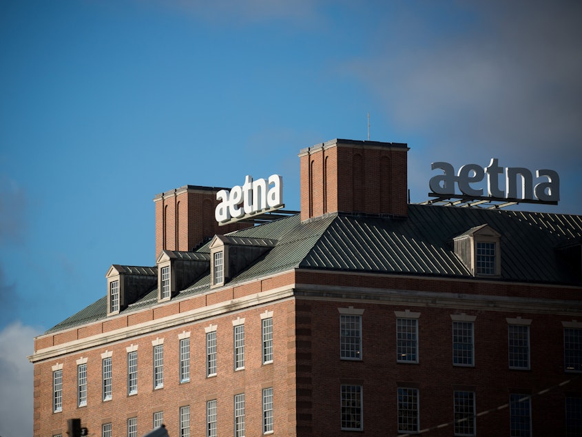 caption: Aetna was the first insurer to announce its plan to help shield patients with COVID-19 from high medical bills. But out-of-network charges and other surprise bills remain a risk, say advocates for patients.