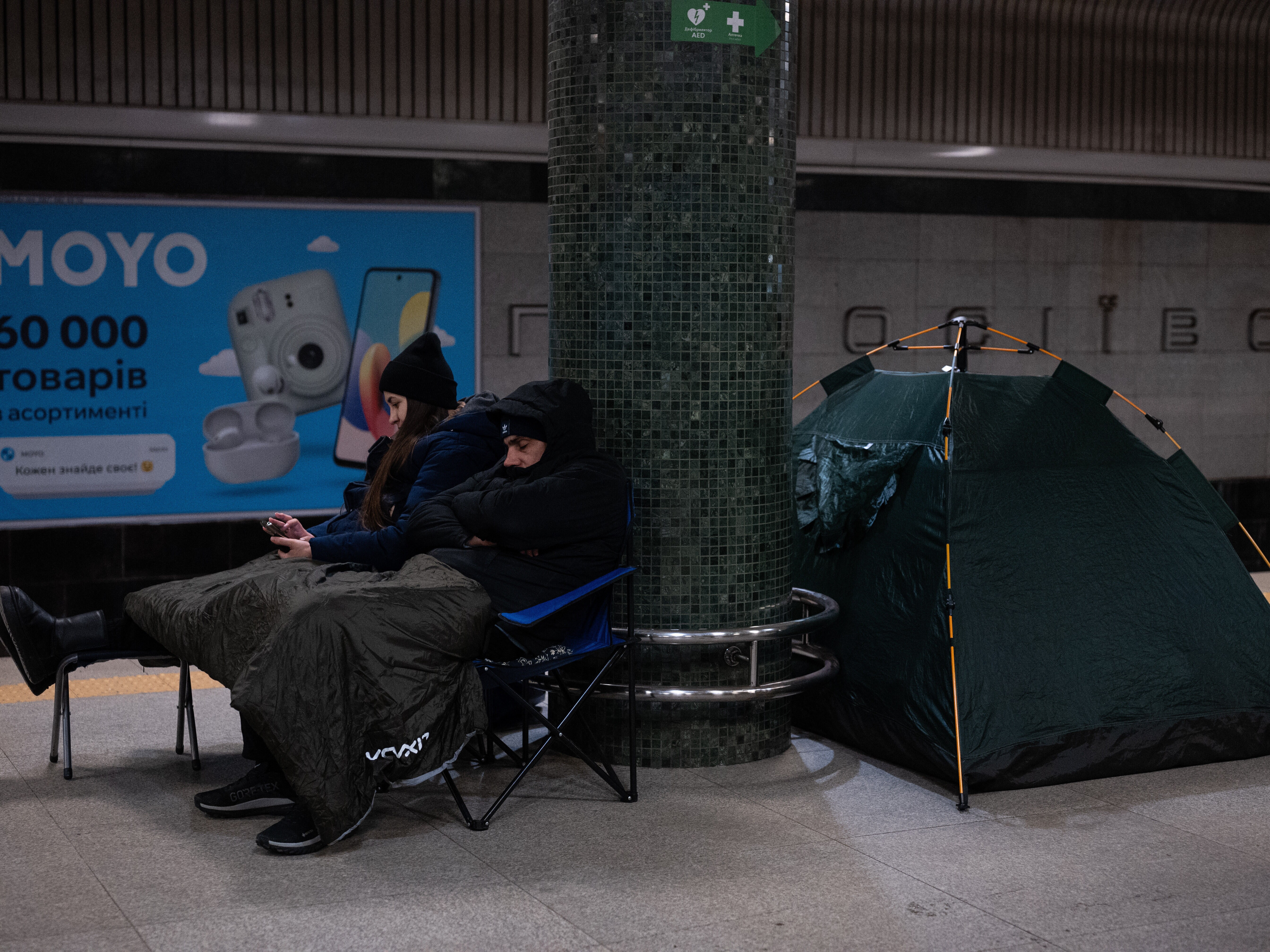 caption: People take shelter in a subway station during Russia's night missile and drone attack in Kyiv, Ukraine, on Saturday, Jan. 24, 2026.