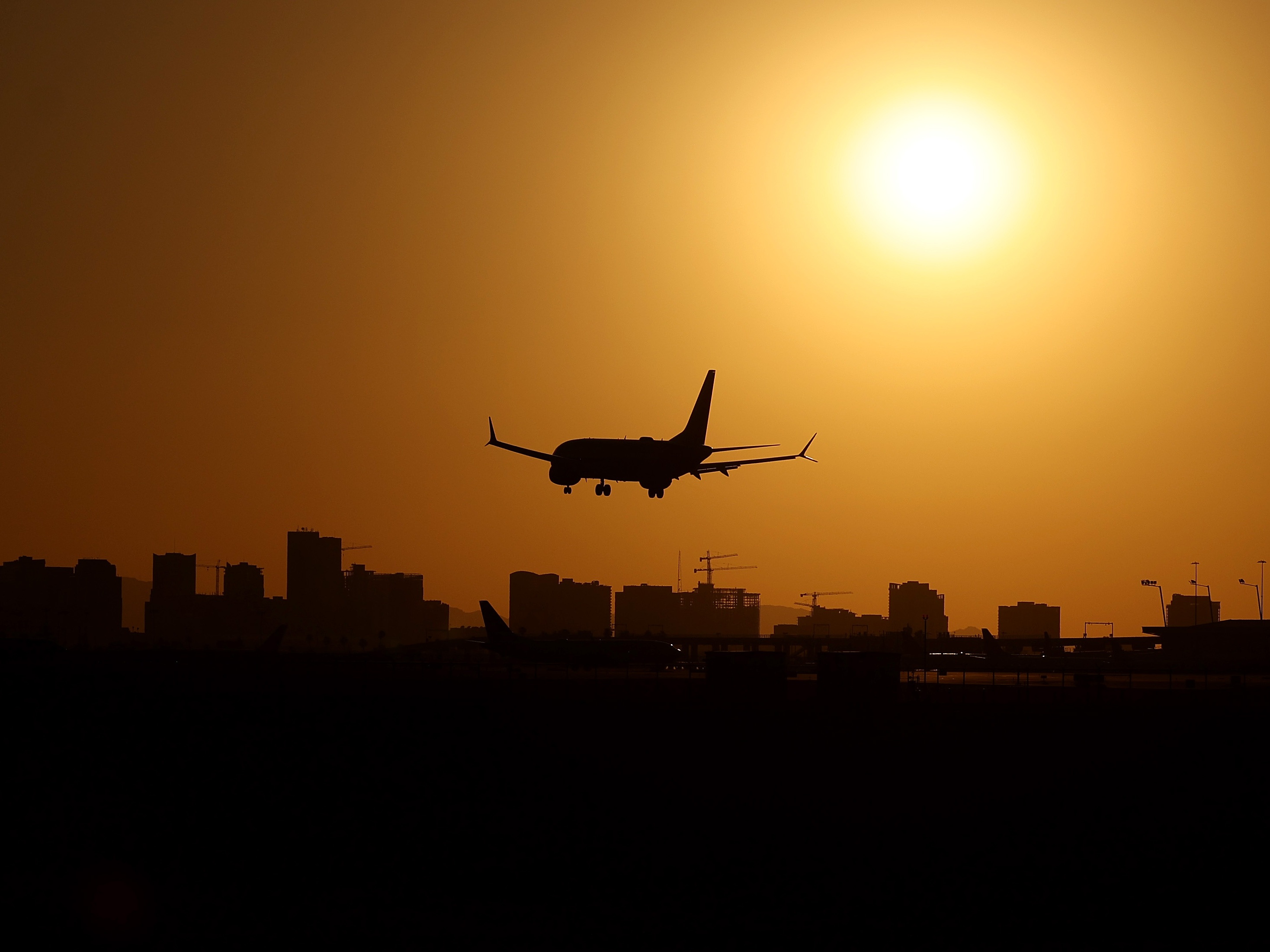 caption: The Federal Aviation Administration is once again looking into a close call at a major U.S. airport, after two planes narrowly avoided a mid-air collision as they were attempting to land over the weekend in Phoenix. A United 737, like the one pictured here, and a Delta A330 flew to within 1,200 feet of each other.