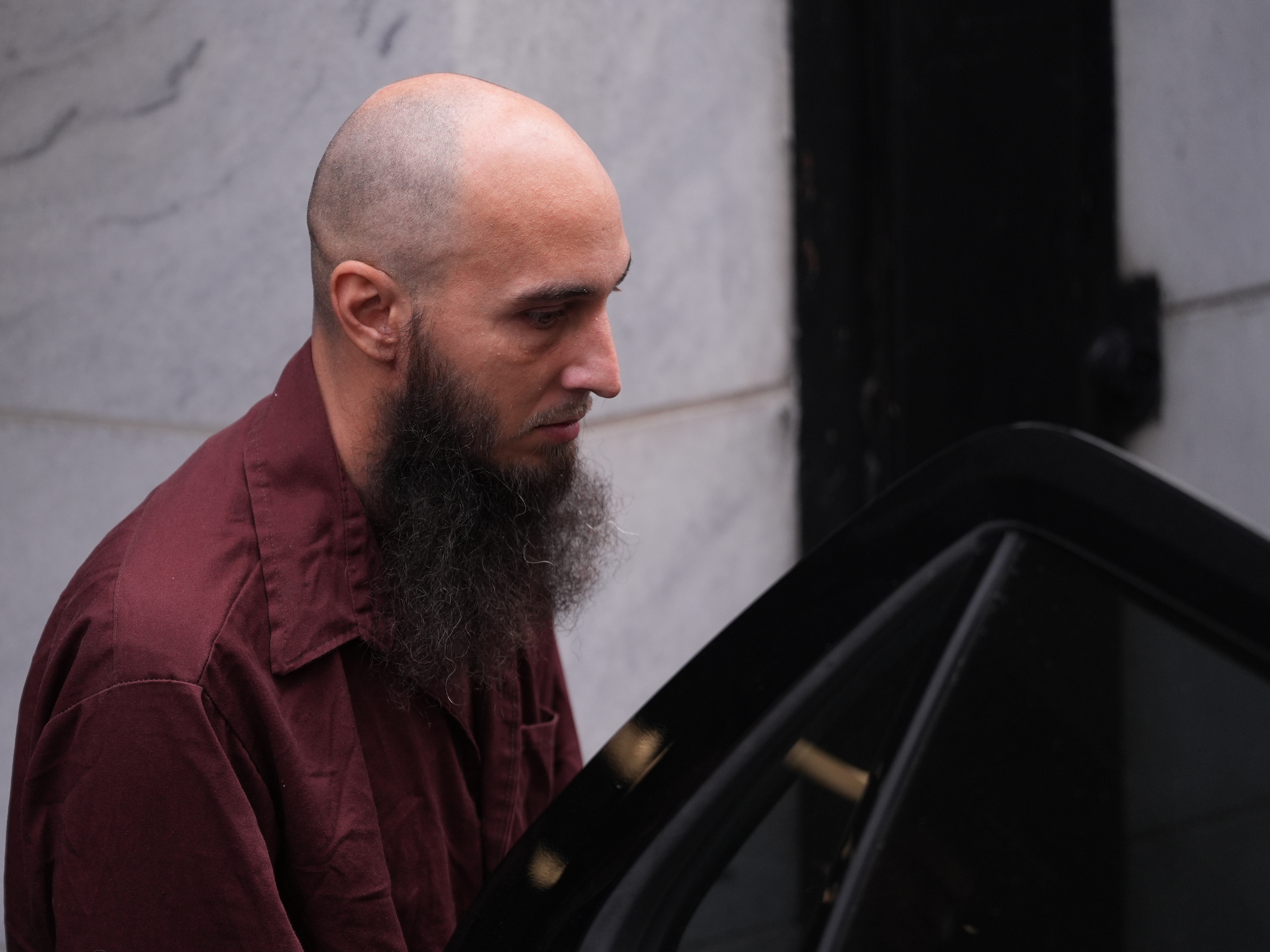 caption: Cody Balmer, accused of setting a fire at Pennsylvania Gov. Josh Shapiro's official residence, leaves Dauphin County Courthouse on Oct. 14, 2025 in Harrisburg, Pa.