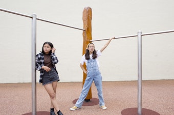 caption: Norah Weiner (L) and Erika Young (R), the grand-prize winners in grades 5-8 of NPR's Student Podcast Challenge, at Presidio Middle School in San Francisco.