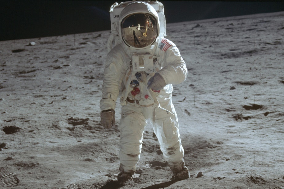 caption: In this July 20, 1969 photo made available by NASA, astronaut Buzz Aldrin, lunar module pilot, walks on the surface of the moon during the Apollo 11 extravehicular activity. (Neil Armstrong/NASA via AP)